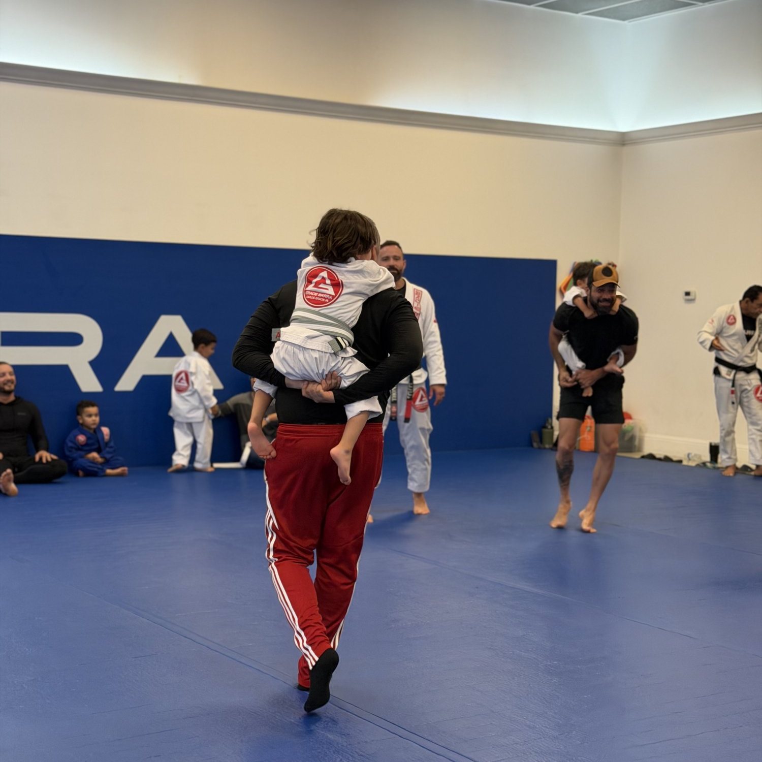 Kids and adults training together at Gracie Barra Davenport